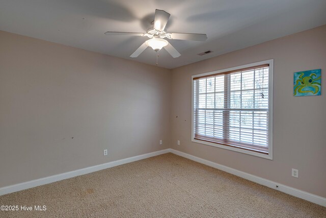 back of property with a sunroom, a patio area, and a lawn