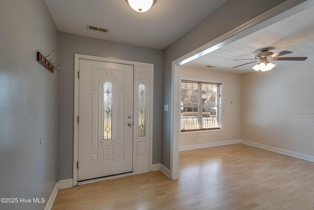 kitchen featuring sink, light brown cabinetry, kitchen peninsula, stainless steel appliances, and a chandelier