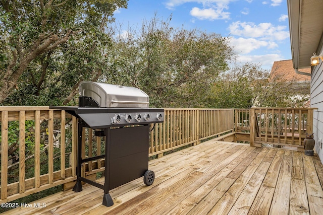 deck featuring a grill