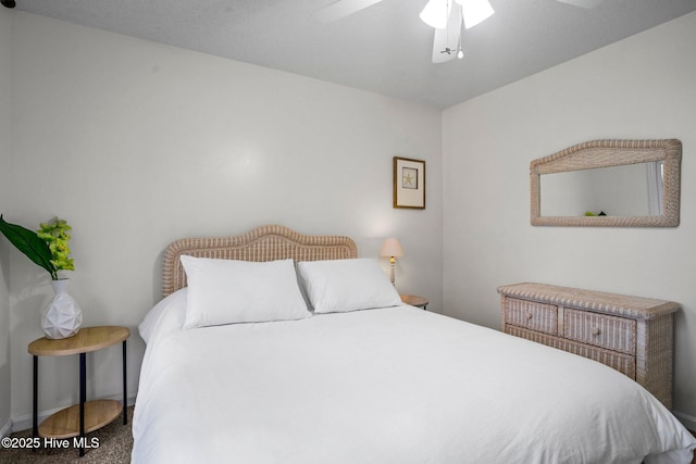 bedroom with ceiling fan and carpet