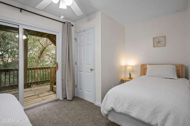 carpeted bedroom featuring access to outside and ceiling fan