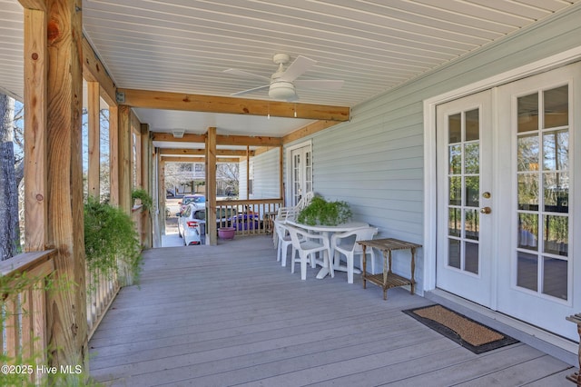 wooden deck featuring french doors and ceiling fan