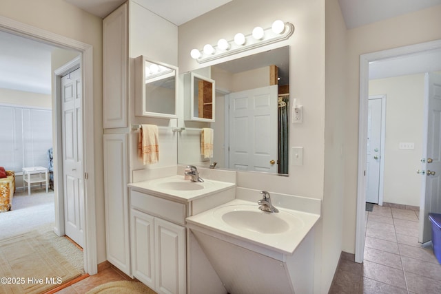 bathroom with tile patterned floors and vanity