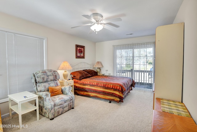 carpeted bedroom with access to exterior and a ceiling fan