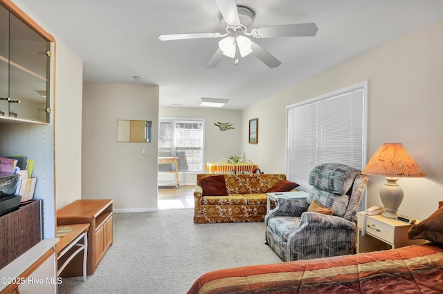 living room with ceiling fan and light colored carpet