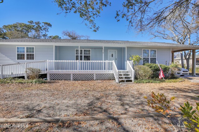 view of front of home with a porch and a shingled roof