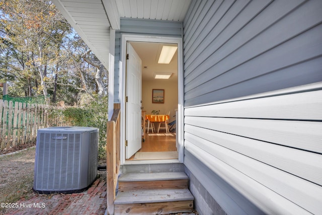 doorway to property with central AC unit