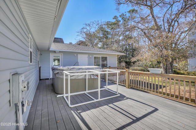 deck featuring a hot tub