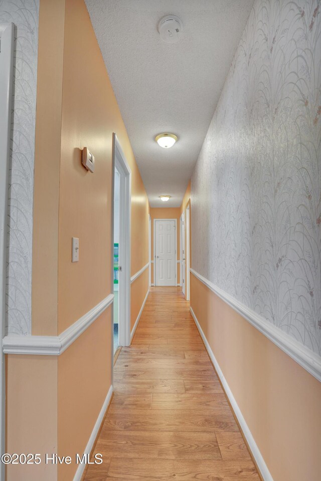 bedroom featuring carpet and a textured ceiling