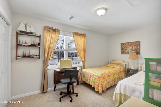 bedroom with carpet flooring, baseboards, and visible vents