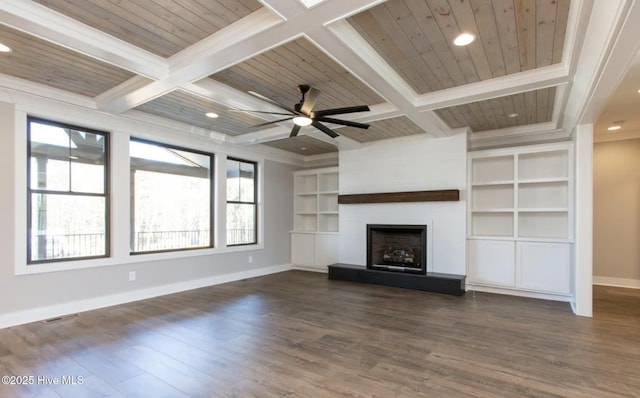 unfurnished living room with beamed ceiling, ornamental molding, and coffered ceiling