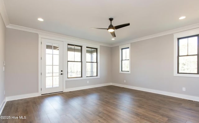 unfurnished room with ceiling fan, crown molding, and dark wood-type flooring