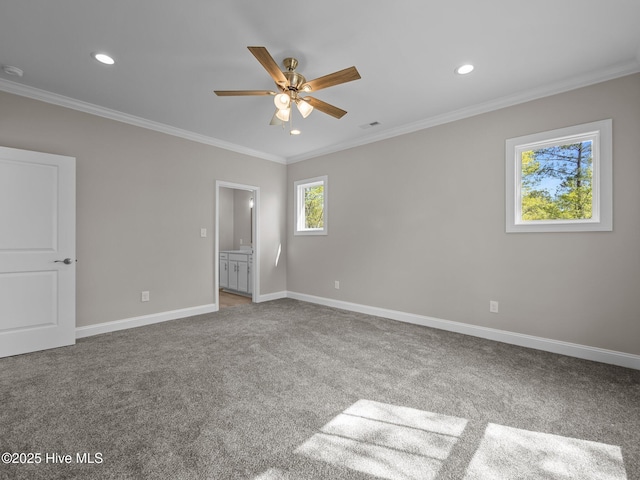 unfurnished bedroom with crown molding, baseboards, recessed lighting, and carpet flooring