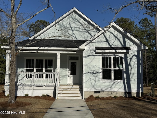 view of front of property with covered porch and crawl space