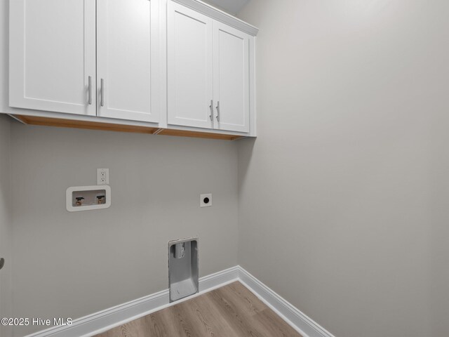 laundry room featuring hookup for an electric dryer, baseboards, washer hookup, cabinet space, and wood finished floors