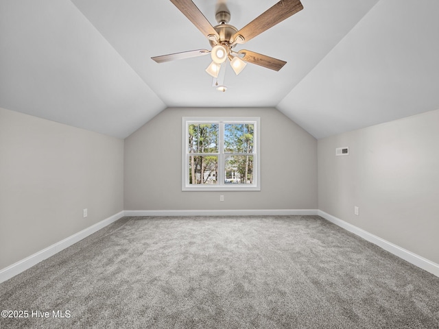 bonus room featuring ceiling fan, baseboards, carpet flooring, and lofted ceiling