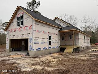 view of side of property featuring a garage