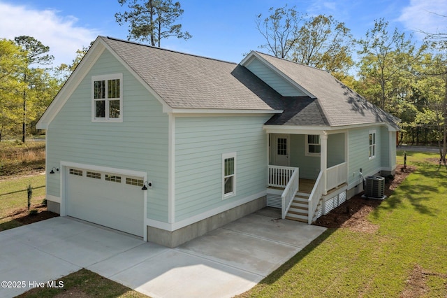 exterior space with central AC, roof with shingles, a front yard, an attached garage, and driveway