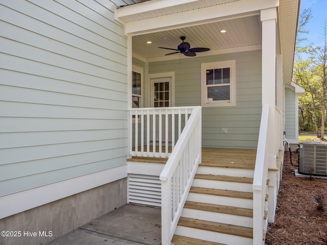 view of exterior entry with ceiling fan and central AC
