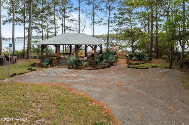 view of home's community featuring a water view and a gazebo