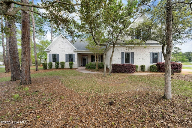 view of front of home featuring brick siding