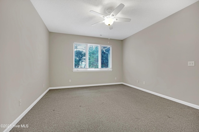 empty room with ceiling fan and carpet flooring