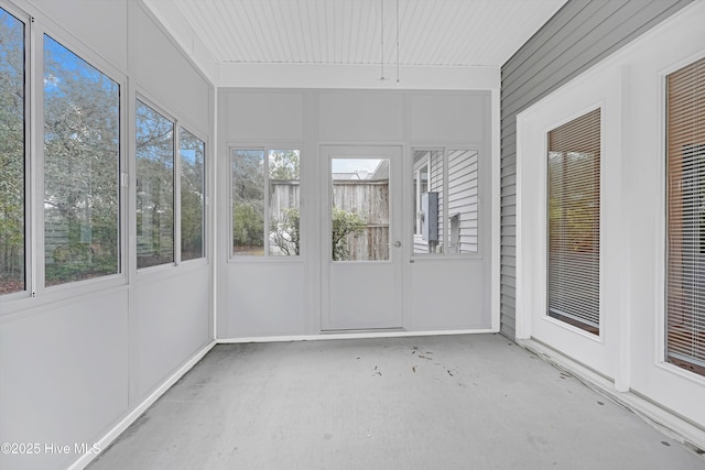 unfurnished sunroom with plenty of natural light