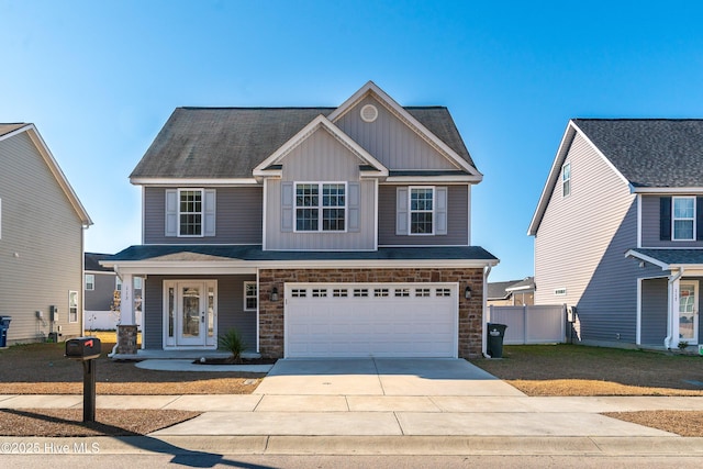 view of front of home featuring a garage and a front lawn