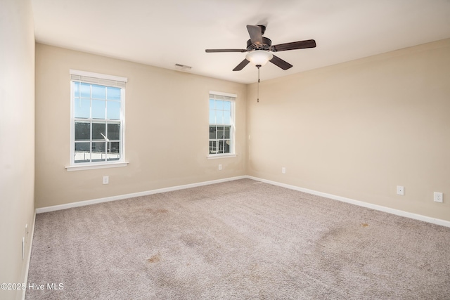 carpeted empty room with ceiling fan