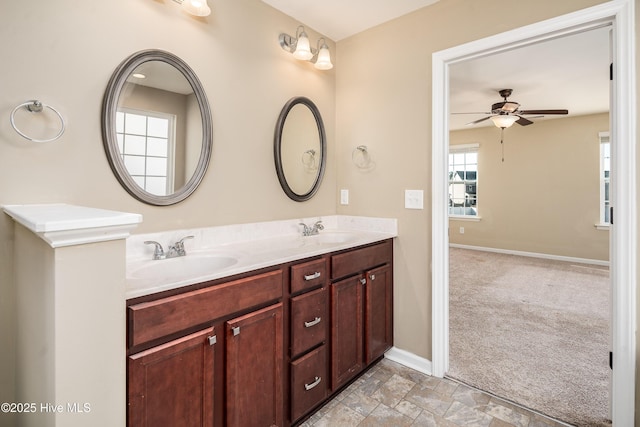 bathroom featuring vanity and ceiling fan