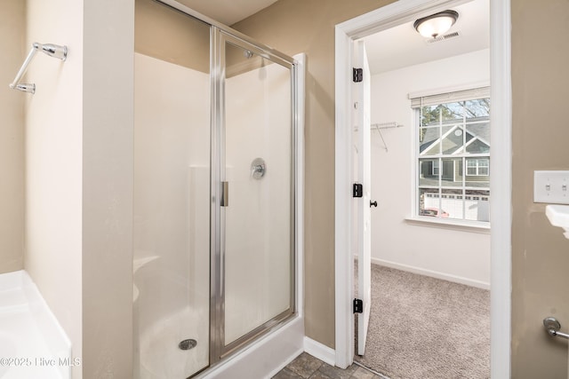 bathroom featuring an enclosed shower