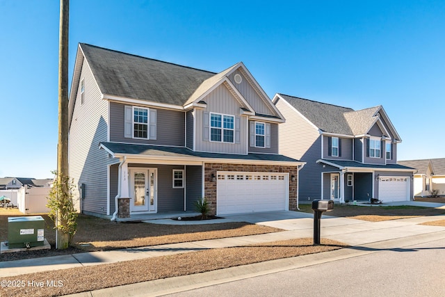 view of front of house with a porch and a garage