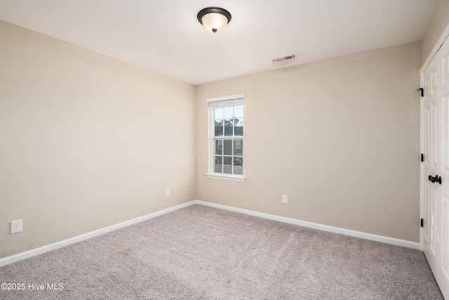 unfurnished room featuring carpet floors