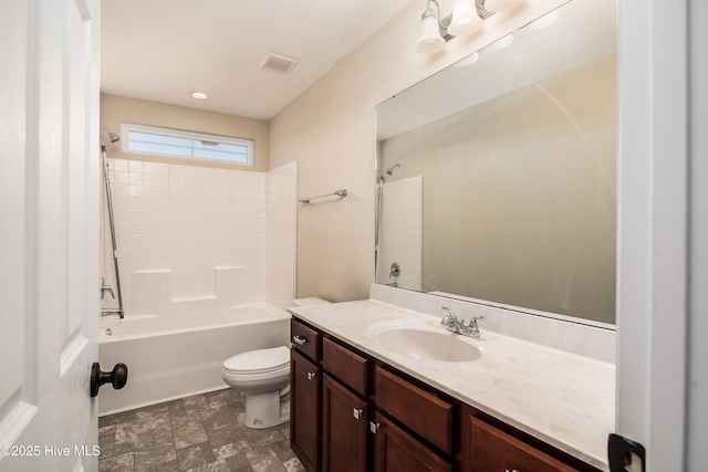 full bathroom featuring shower / tub combination, vanity, and toilet