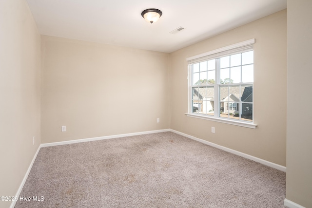 spare room featuring carpet floors