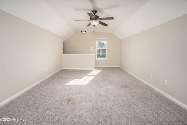 bonus room with ceiling fan, lofted ceiling, and carpet floors