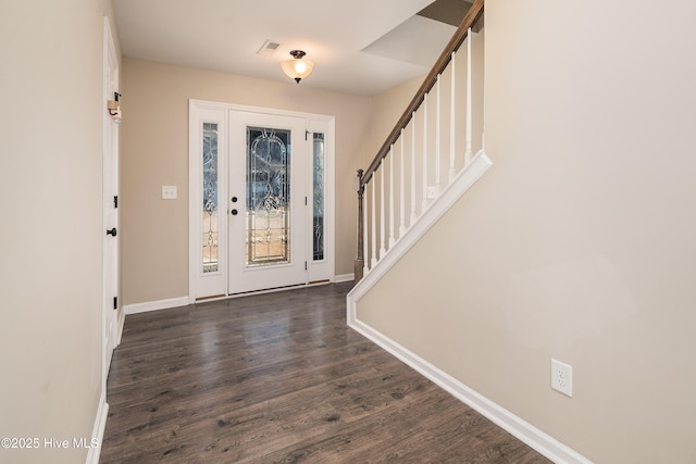 foyer entrance featuring dark hardwood / wood-style floors