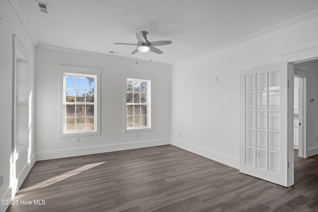 spare room featuring ceiling fan, ornamental molding, and dark hardwood / wood-style floors