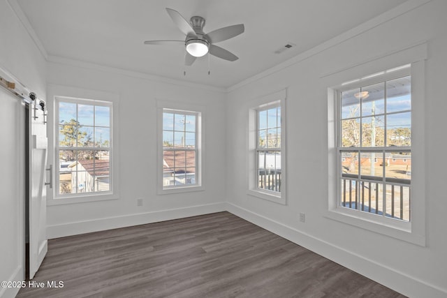 empty room featuring ceiling fan, ornamental molding, and dark hardwood / wood-style flooring