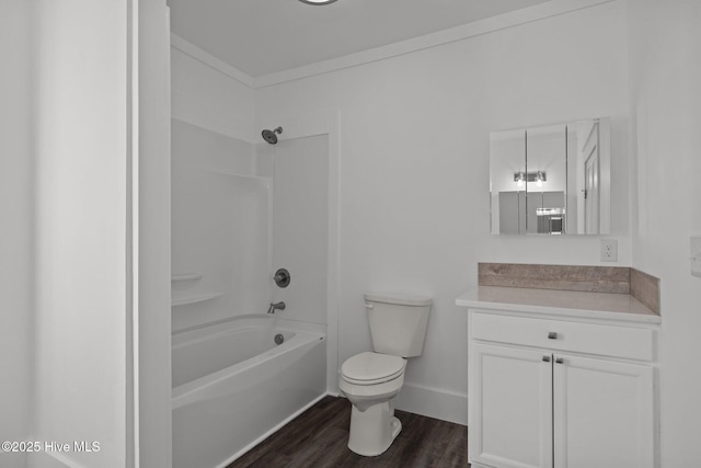 full bathroom featuring hardwood / wood-style flooring, toilet,  shower combination, vanity, and crown molding