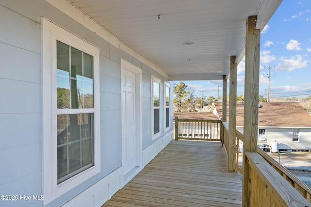 wooden terrace with a porch