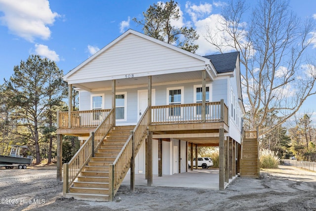 coastal home with a carport and a porch