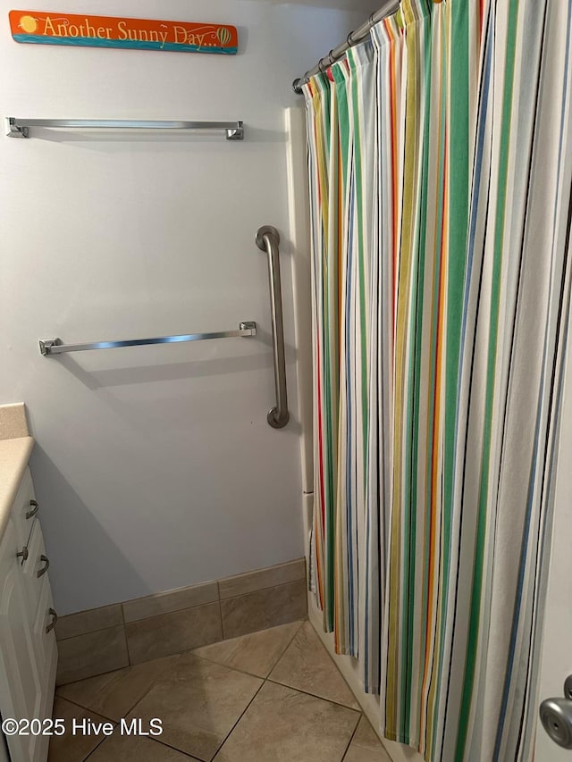 bathroom featuring tile patterned floors, vanity, and a shower with shower curtain