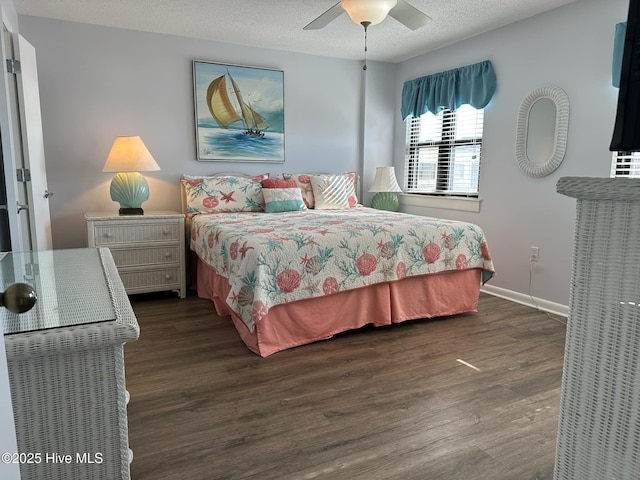 bedroom featuring a textured ceiling, dark hardwood / wood-style flooring, and ceiling fan