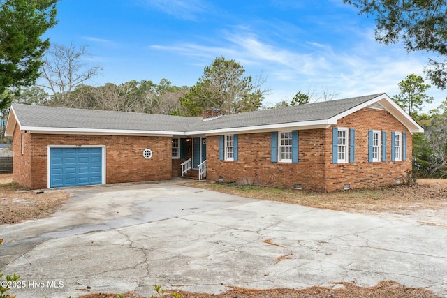 ranch-style home featuring a garage