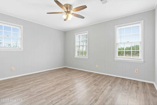 unfurnished room with ornamental molding, ceiling fan, and light hardwood / wood-style floors