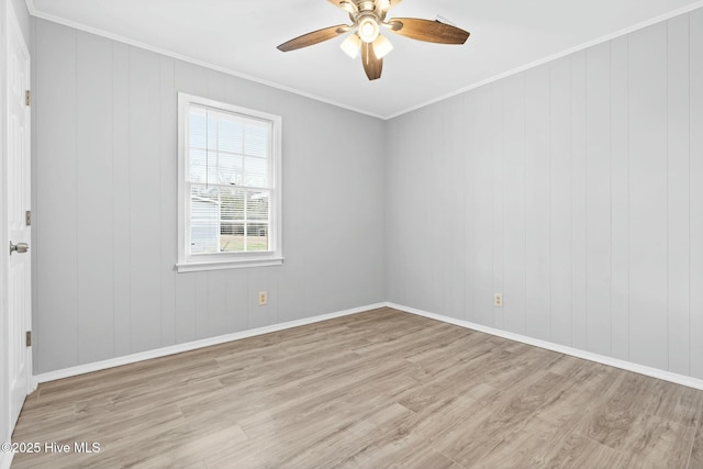 unfurnished room featuring ceiling fan, light wood-type flooring, and crown molding