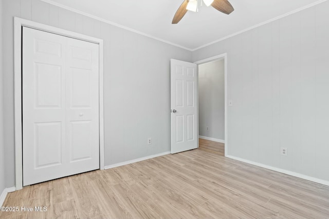 unfurnished bedroom with a closet, ceiling fan, light hardwood / wood-style floors, and ornamental molding