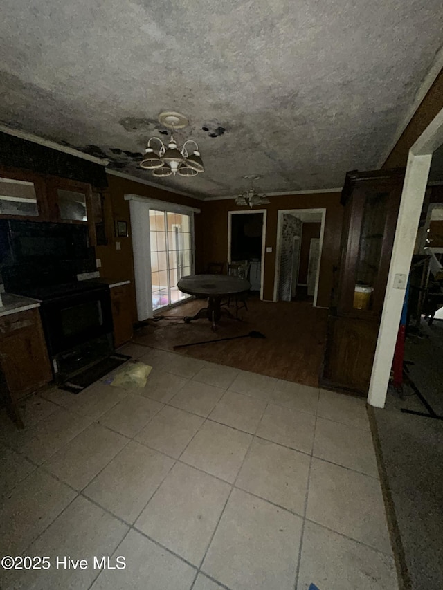 interior space with light tile patterned flooring and a notable chandelier