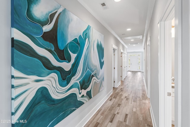 106 SE 36th St, Oak Island, NC 28465 - corridor featuring wood finished floors, baseboards, and recessed lighting
